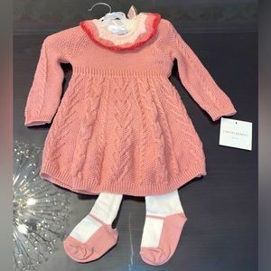 A knitted baby girls dress with footed leggings and matching headband